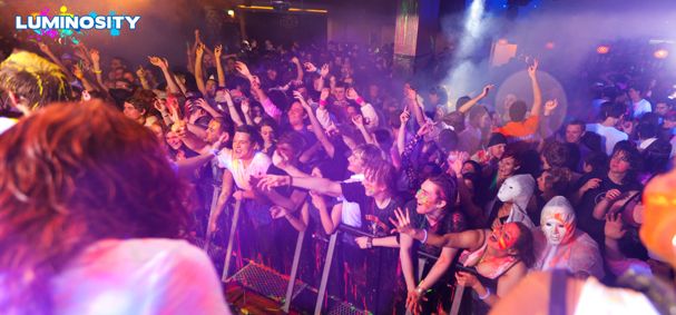 crowd of people at a paint party